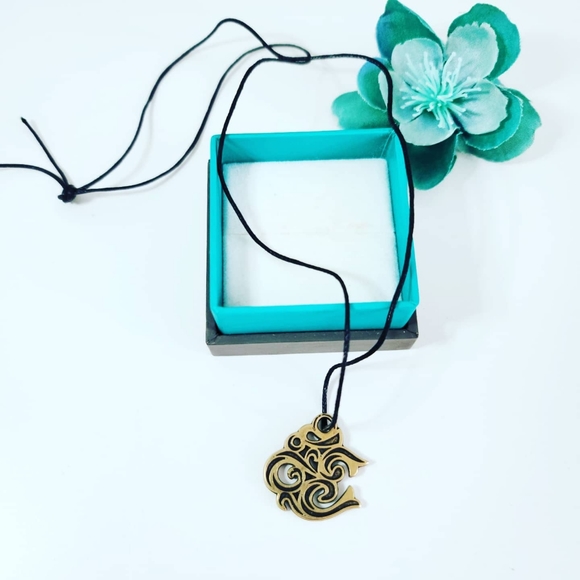 Sacred "Om" symbol pendant with a cord - Picture 2 of 3